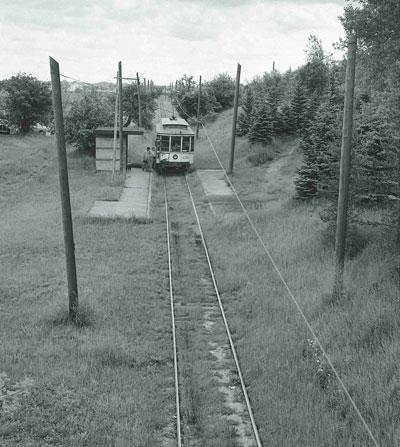 A westbound car makes a stop prior to passing under Cleveland Avenue. Photo courtesy of University of Minnesota Archives