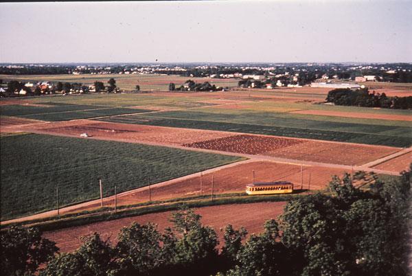Toward the end of its 40-year run, the trolley starts the turn to follow Gortner Avenue south to the St. Paul campus. This photo was taken from the campus water tower. Photo courtesy of Minnesota Streetcar Museum